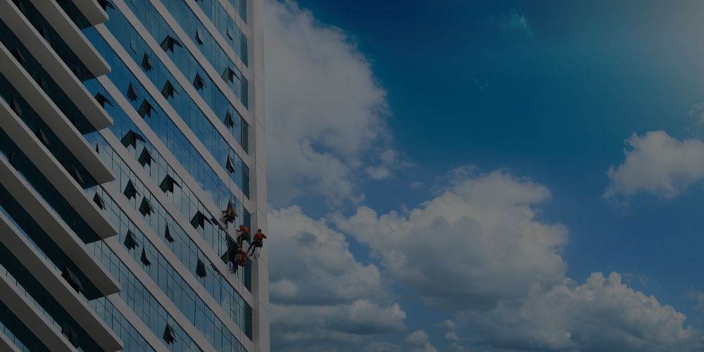 Read more about the article The Challenges and Solutions of High-Rise Window Cleaning